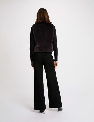 Mouwloze jas zwart vrouw