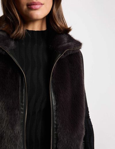 Mouwloze jas zwart vrouw