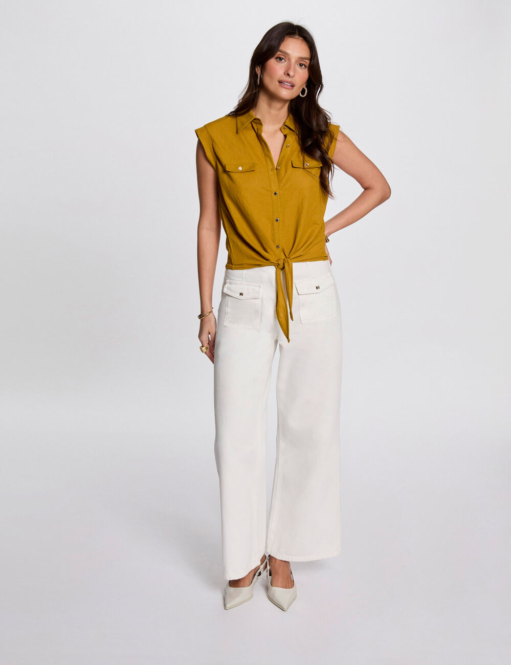Mouwloze blouse mosterd geel vrouw