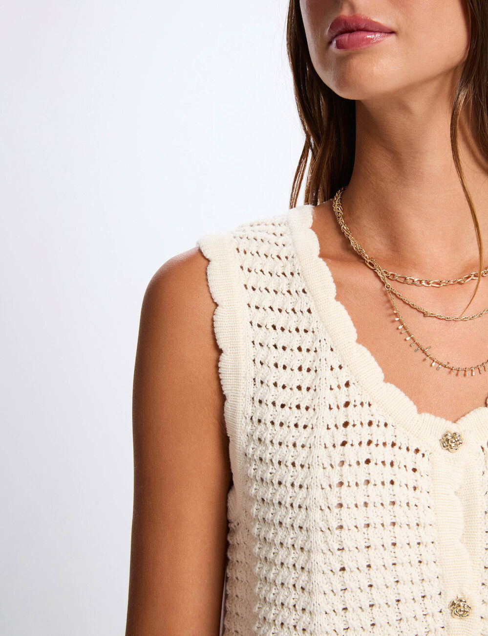 Mouwloos opengewerkt vest ivoor vrouw
