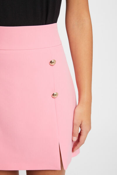 Korte rok met knopen medium roze vrouw