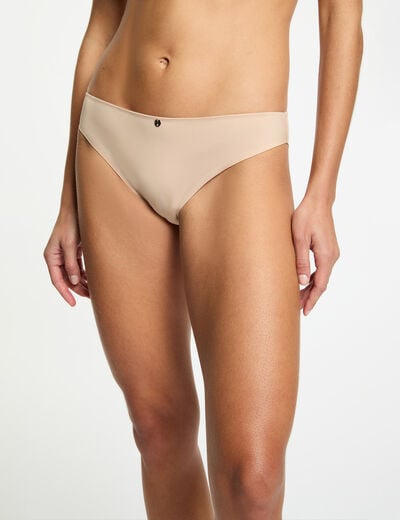 Kant tanga beige vrouw
