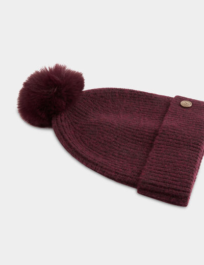 Gebreide muts met knoop pruim vrouw