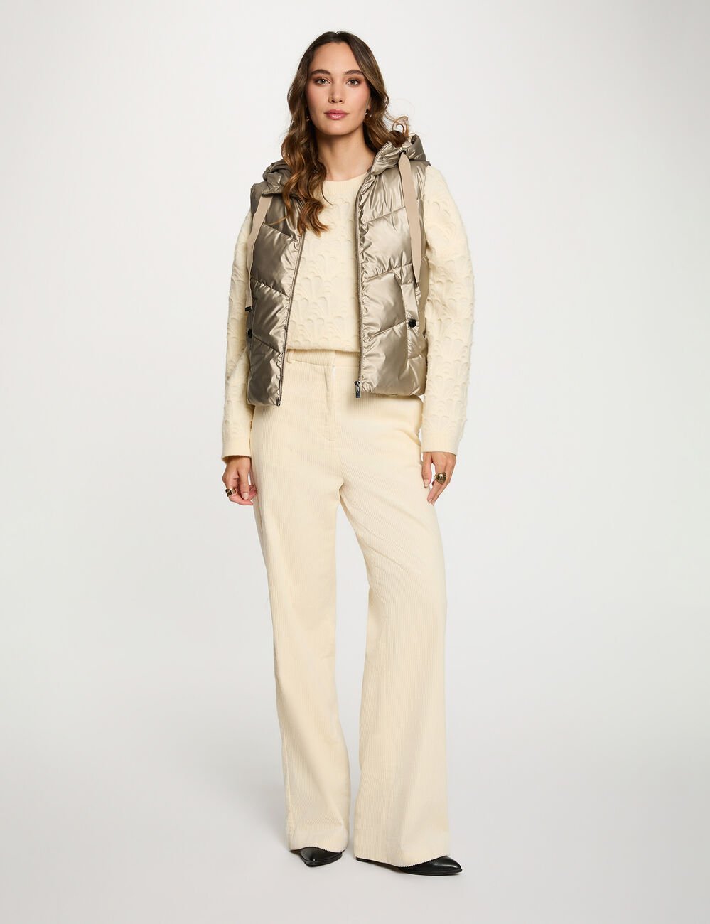 glanzende mouwloze bodywarmer goudgeel vrouw Glanzende mouwloze bodywarmer goudgeel vrouw