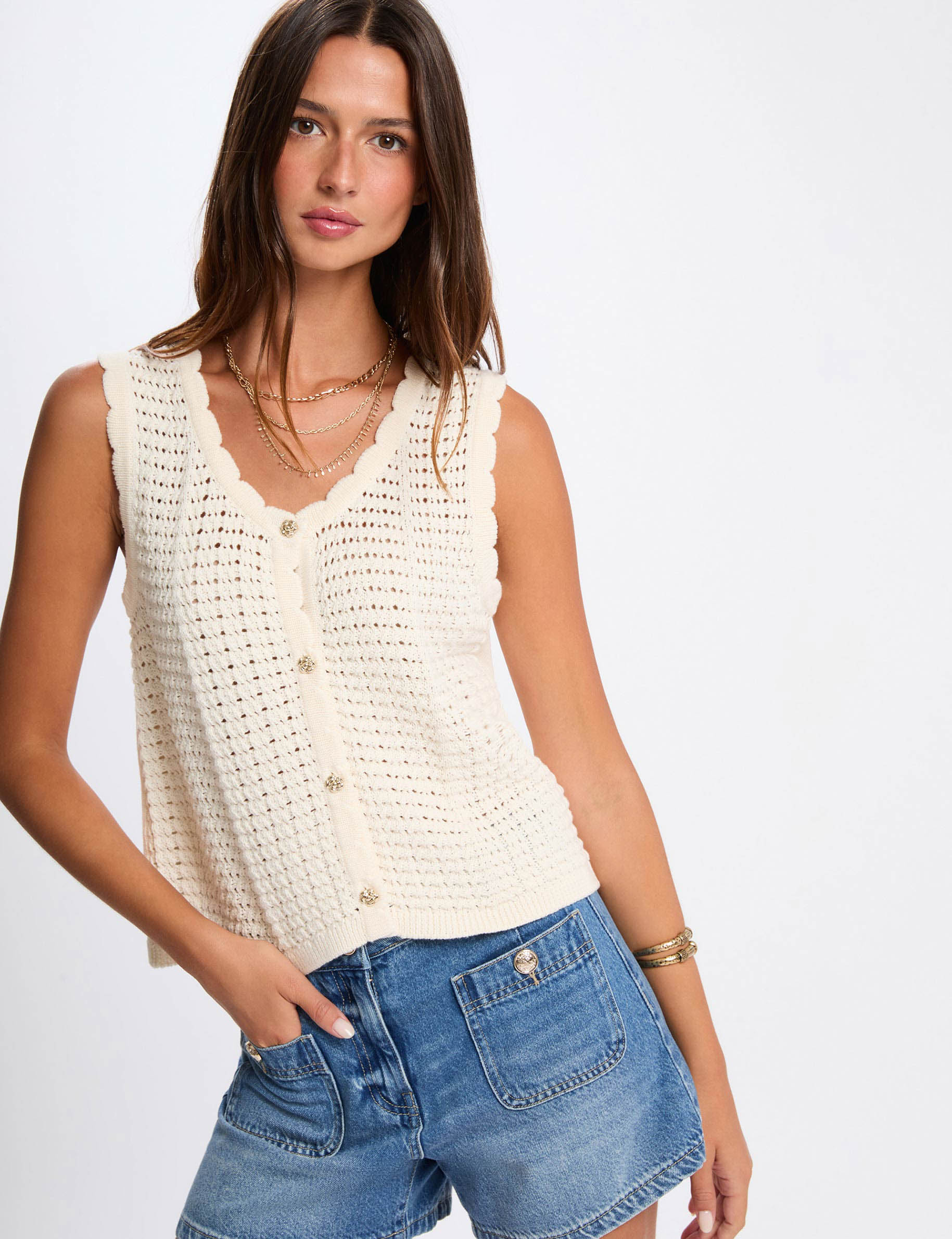 Mouwloos opengewerkt vest ivoor vrouw