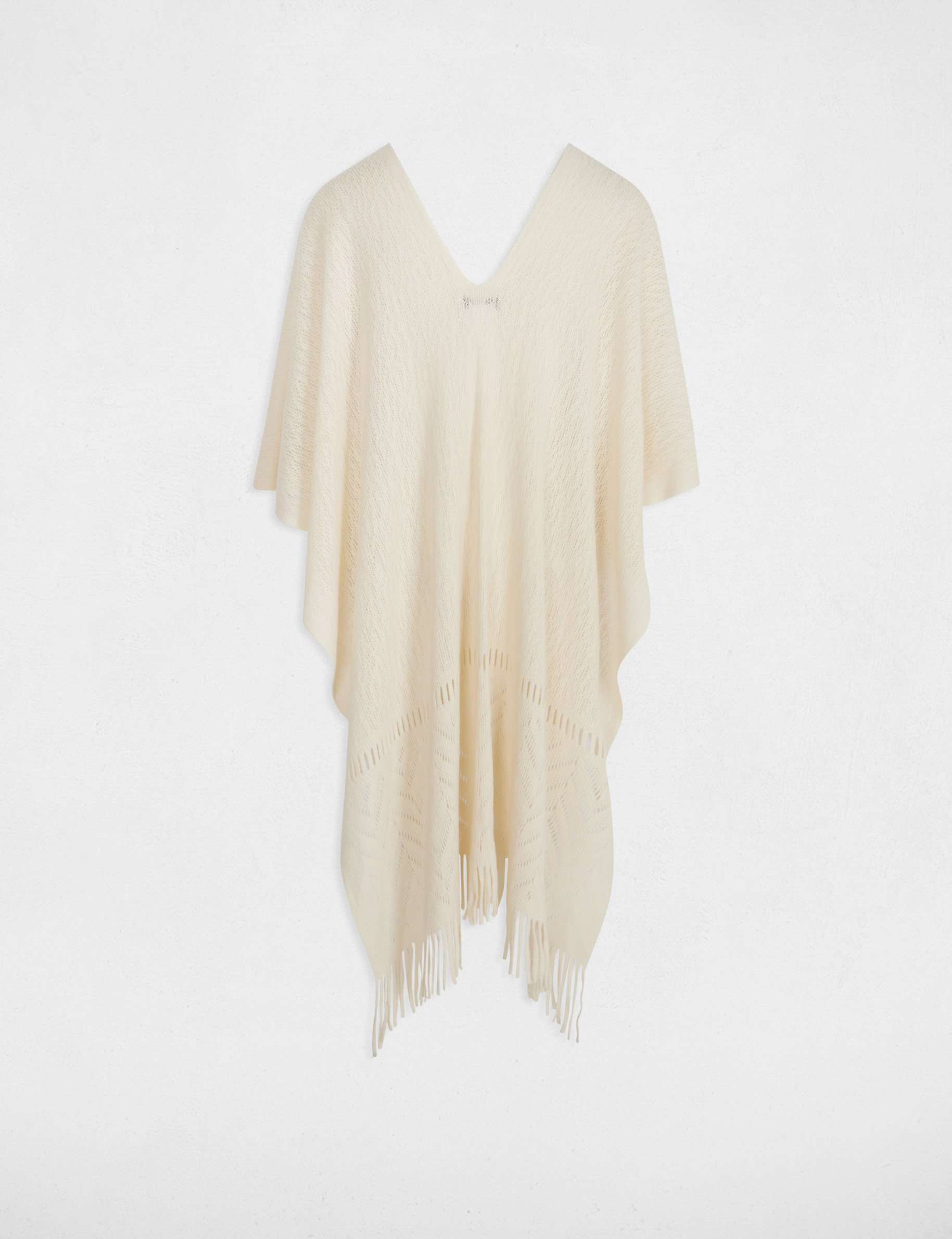gebreide cape met franjes ivoor vrouw Gebreide cape met franjes ivoor vrouw