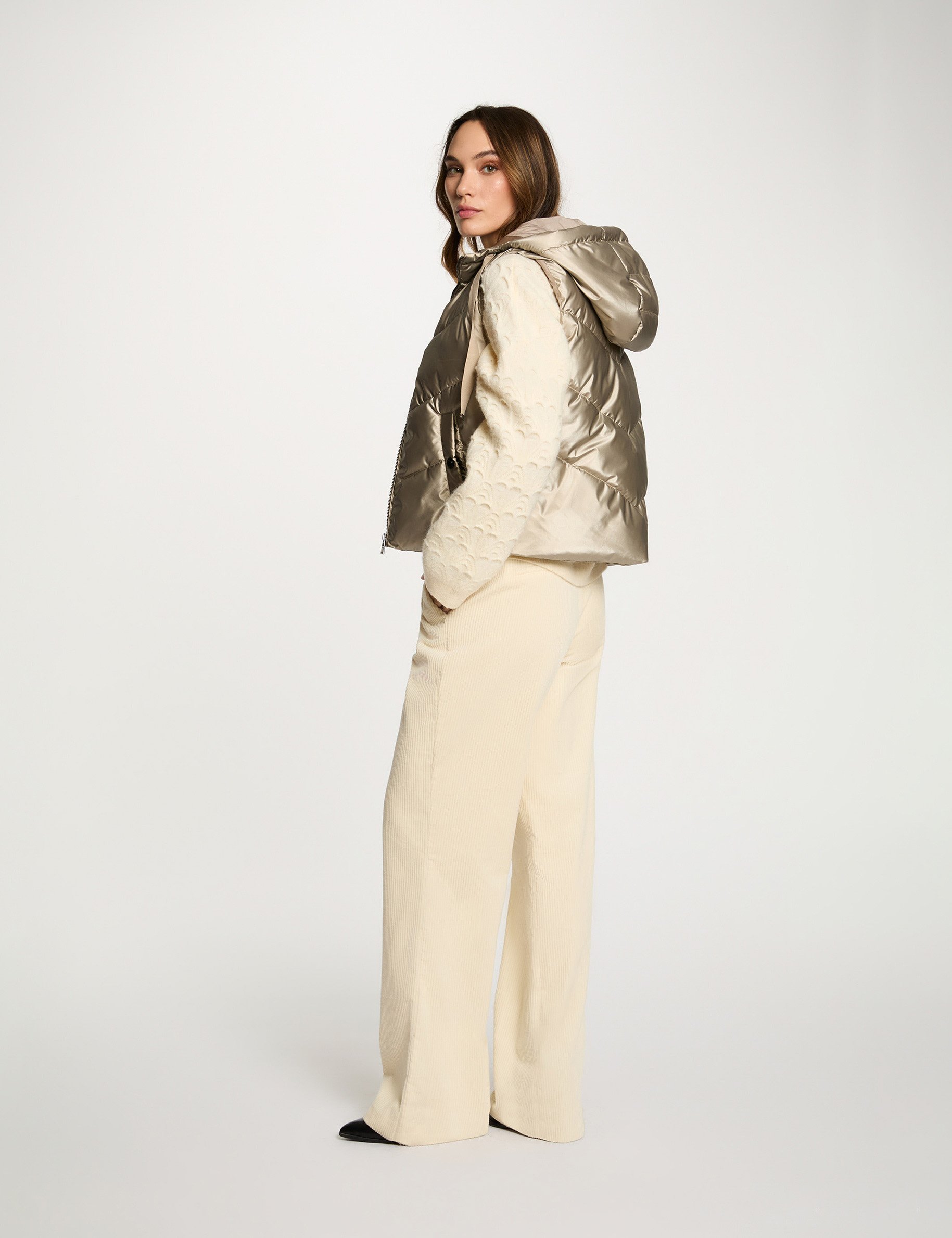 glanzende mouwloze bodywarmer goudgeel vrouw Glanzende mouwloze bodywarmer goudgeel vrouw