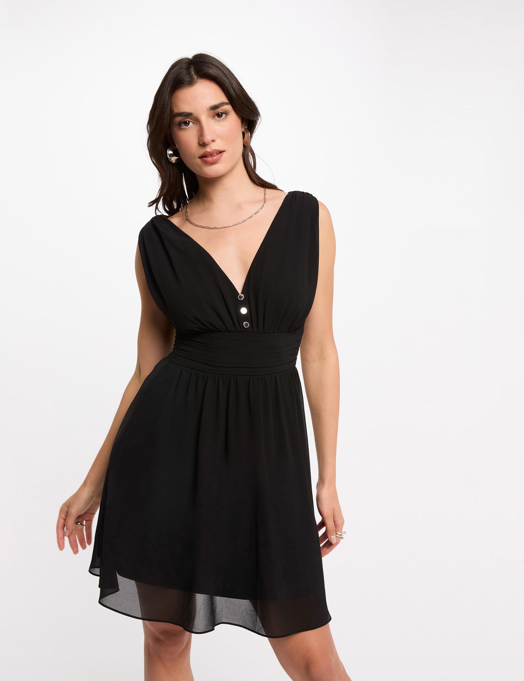 Korte vloeiende uitlopende jurk zwart vrouw